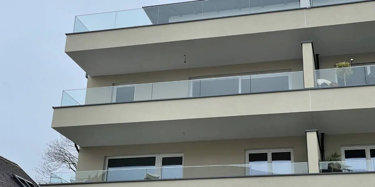 Glass or metal balustrade system on modern apartment balconies