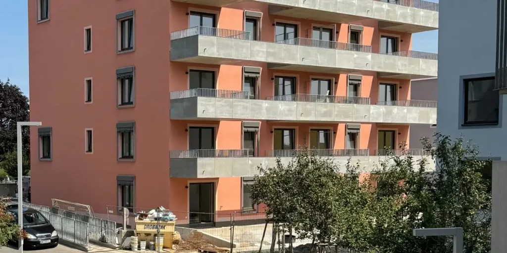 Prefabricated parapet elements on a construction site ready for rapid installation.